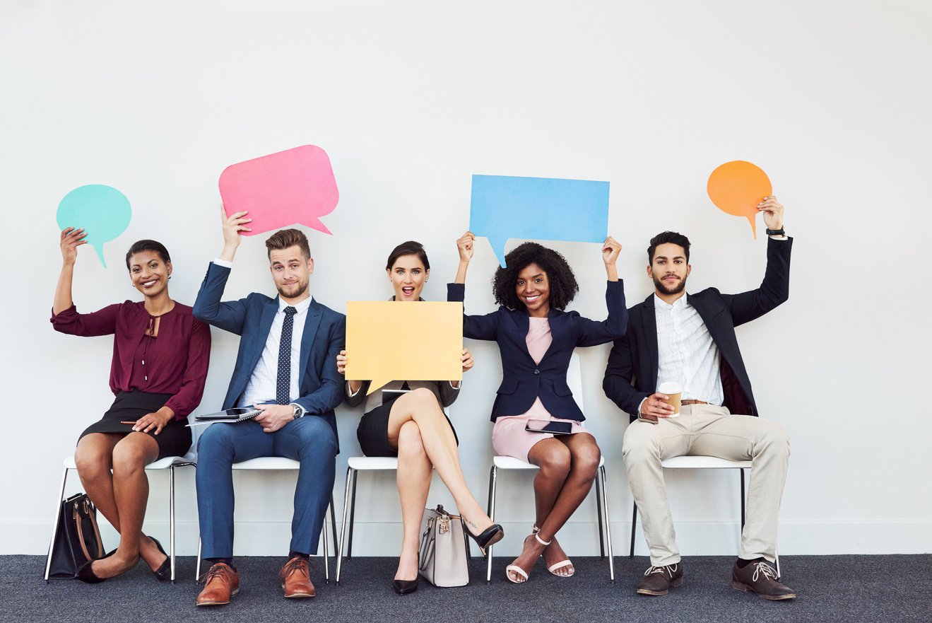  Employees Holding Speech Bubbles